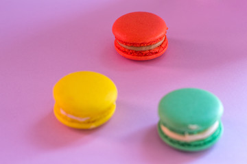 Close-up shot of colored macaroons in different position