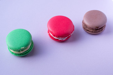 Close-up shot of colored macaroons in different position
