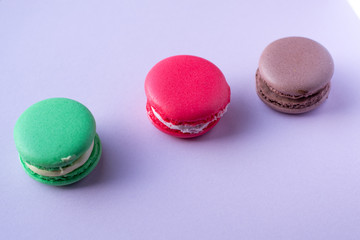 Close-up shot of colored macaroons in different position