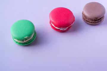 Close-up shot of colored macaroons in different position