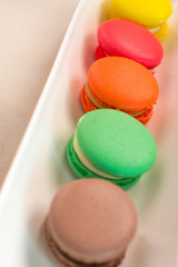 Close-up shot of colored macaroons in different position