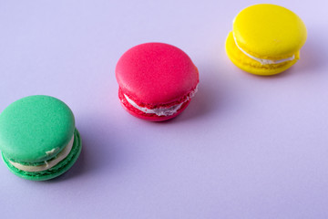 Close-up shot of colored macaroons in different position