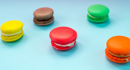 Close-up shot of colored macaroons in different position