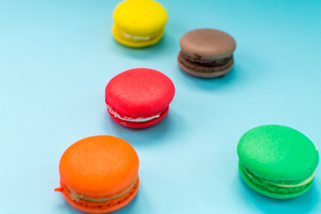 Close-up shot of colored macaroons in different position