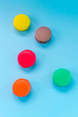Close-up shot of colored macaroons in different position
