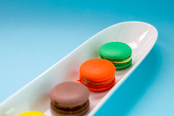 Close-up shot of colored macaroons in different position