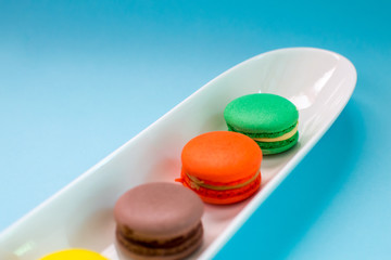 Close-up shot of colored macaroons in different position