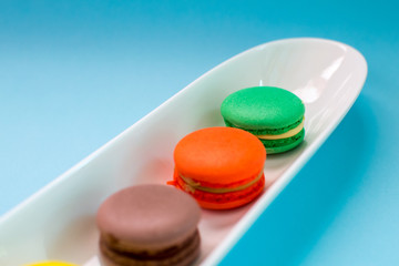 Close-up shot of colored macaroons in different position