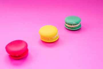 Close-up shot of colored macaroons in different position