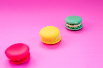 Close-up shot of colored macaroons in different position