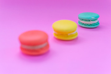 Close-up shot of colored macaroons in different position