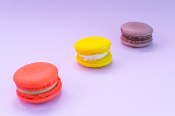 Close-up shot of colored macaroons in different position