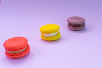 Close-up shot of colored macaroons in different position