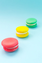 Close-up shot of colored macaroons in different position
