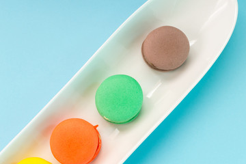 Close-up shot of colored macaroons in different position