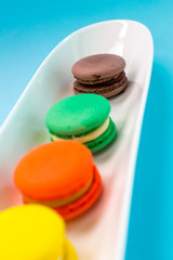 Close-up shot of colored macaroons in different position