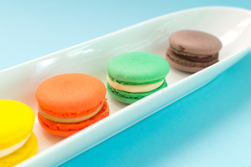 Close-up shot of colored macaroons in different position