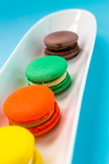 Close-up shot of colored macaroons in different position