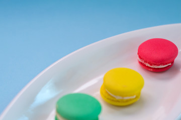 Close-up shot of colored macaroons in different position