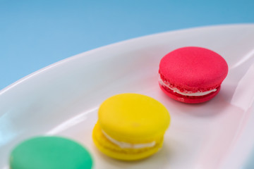 Close-up shot of colored macaroons in different position