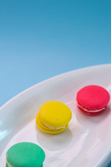Close-up shot of colored macaroons in different position