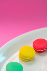 Close-up shot of colored macaroons in different position
