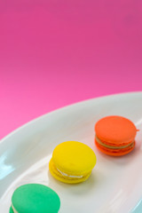 Close-up shot of colored macaroons in different position