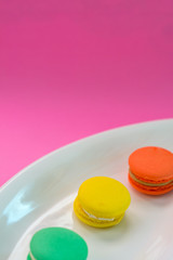 Close-up shot of colored macaroons in different position