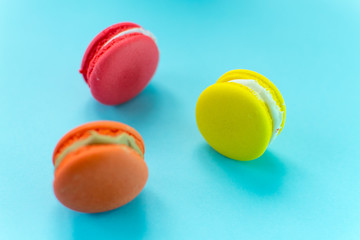 Close-up shot of colored macaroons in different position