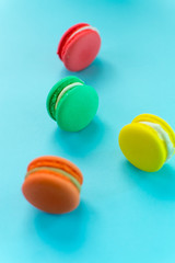 Close-up shot of colored macaroons in different position
