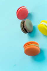 Close-up shot of colored macaroons in different position