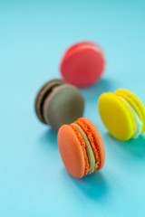 Close-up shot of colored macaroons in different position