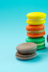 Close-up shot of colored macaroons in different position