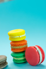 Close-up shot of colored macaroons in different position