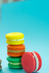 Close-up shot of colored macaroons in different position