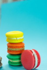 Close-up shot of colored macaroons in different position