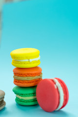 Close-up shot of colored macaroons in different position