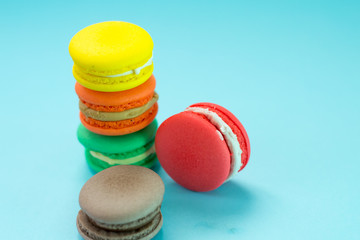 Close-up shot of colored macaroons in different position