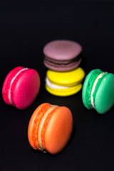 Close-up shot of colored macaroons in different position
