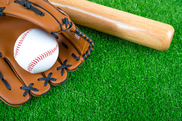 baseball time, glove, ball and bat on green grass