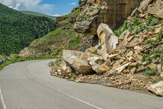 Rockfall on the road in the mountains.