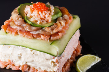 Piece of traditional savory swedish sandwich cake Smorgastorta
