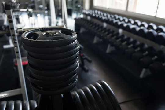 Black steel burbell disks in gym