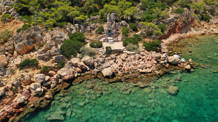 Aerial drone photo of rocky seascape in Vouliagmeni peninsula, Athens riviera, Attica, Greece