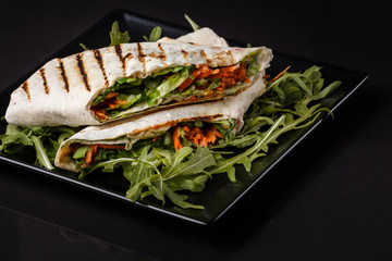 Vegetarian delicious pita with arugula and carrots