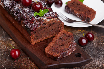 Chocolate brownie cake with cherries. Delicious homemade sweet dessert. 