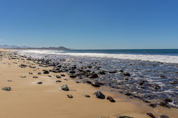 endless sandy beach at the Mexican pacific coast near Todos Santos in Baja California