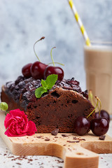 Chocolate brownie cake with cherries. Delicious homemade sweet dessert. 