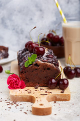 Chocolate brownie cake with cherries. Delicious homemade sweet dessert. 