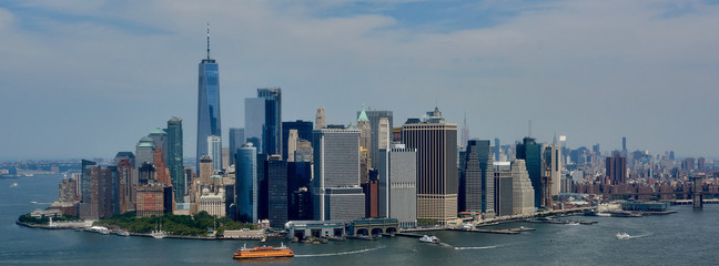 Manhattan skyscrapers in New York city with blue skies in the background